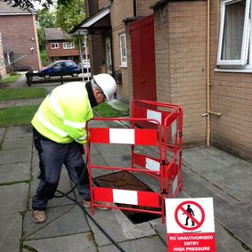 Man working, Drain Cleaning in Worsley, Manchester