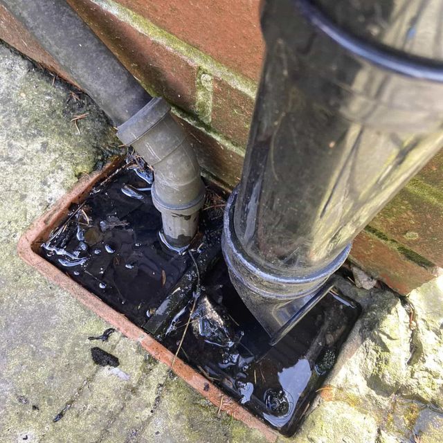clearing a blocked drain